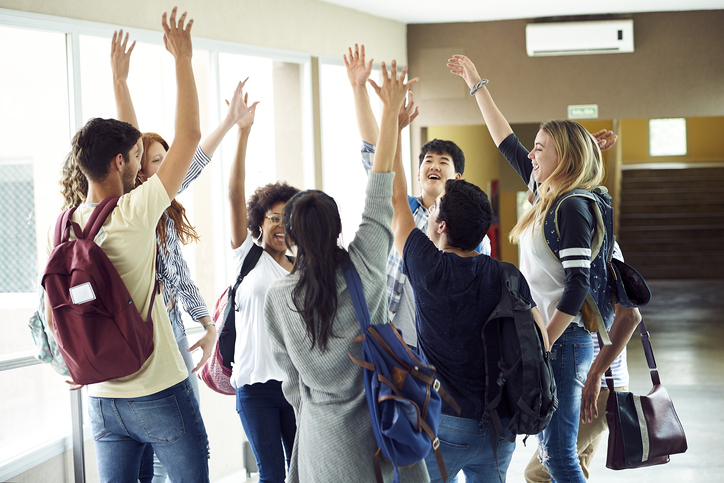 Students in a group after a successful project