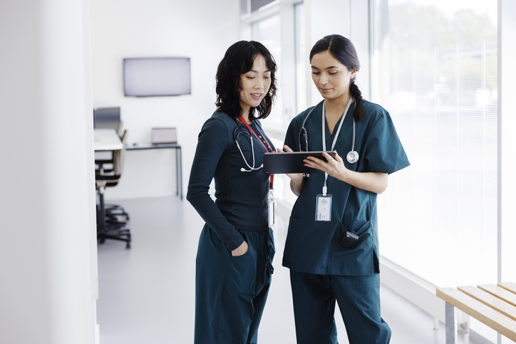 Nurses discussing patient's chart