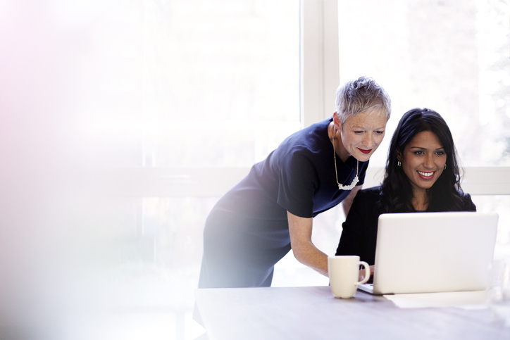 Older professional woman mentoring a younger woman