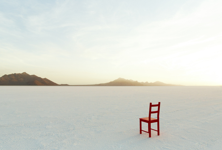 Red Chair on salt flats, facing the distance - stock photo