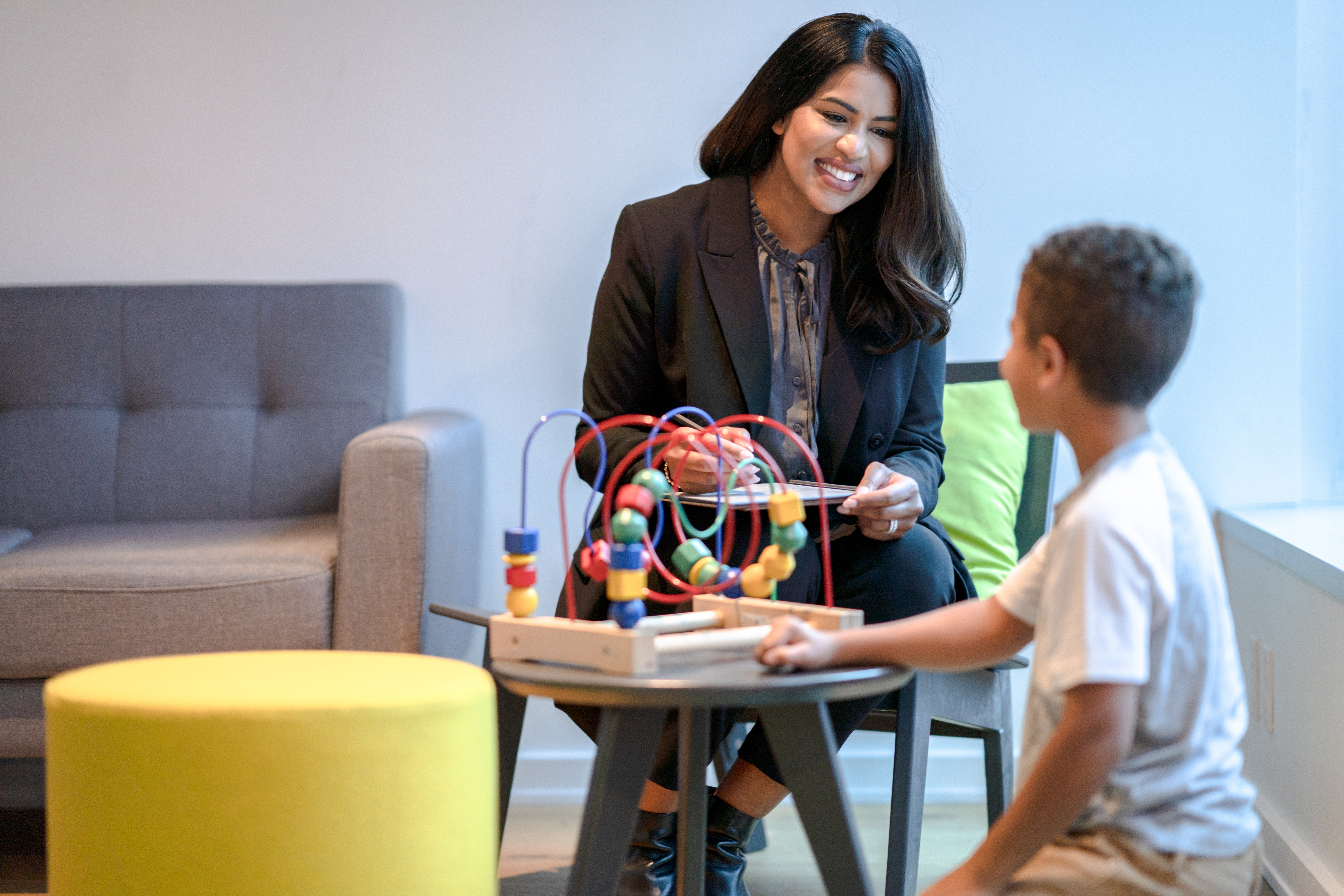 Child life specialist working with a young child