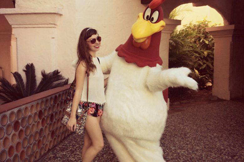 Kaitlyn stands with Foghorn Leghorn in Gold Coast