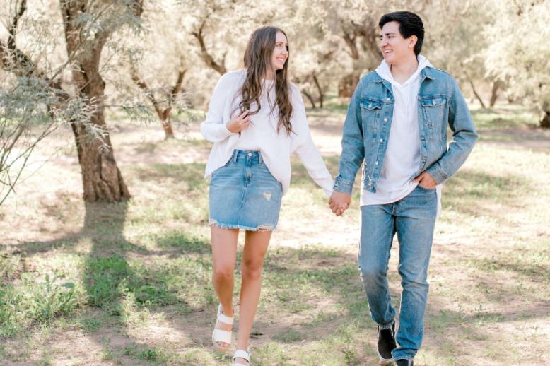 girl and guy holding hands