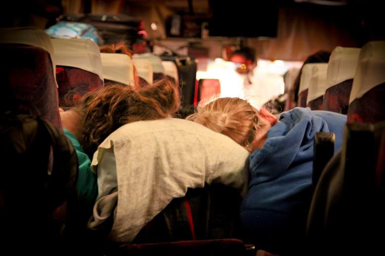 people asleep on a bus