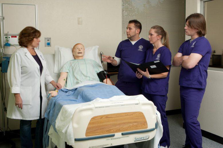 Nursing students learn patient techniques in a clinical setting