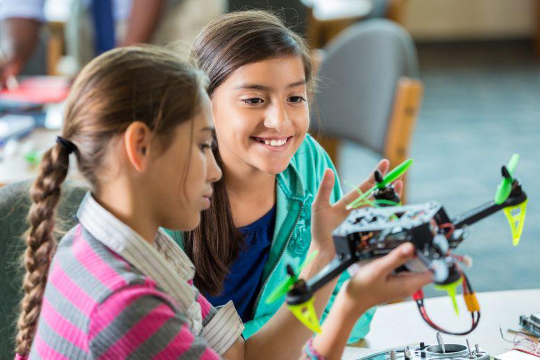 Kids playing with robot