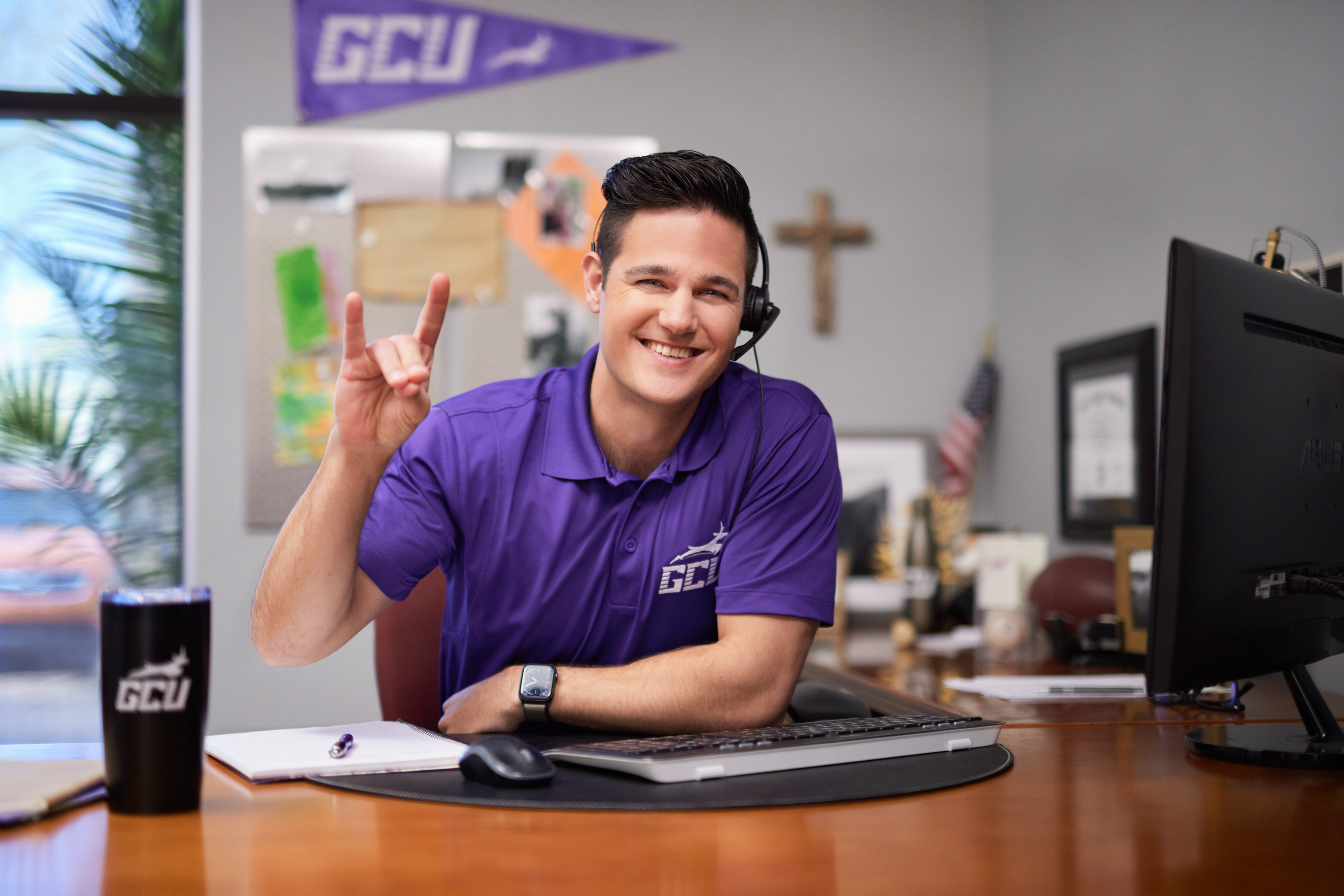 GCU Student helping at a service center