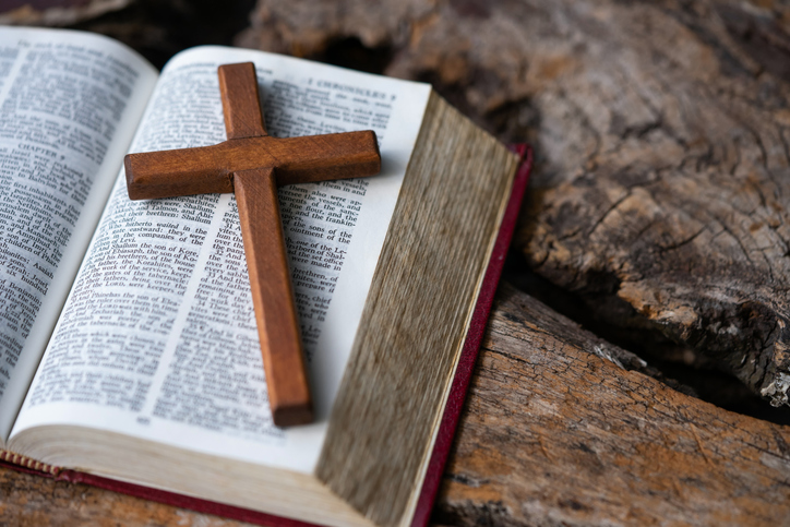 Holy cross on the Bible 
