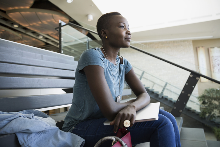 Adult learner with her school materials 