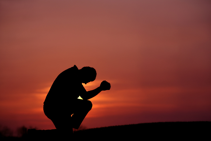 Man praying in the name of God 