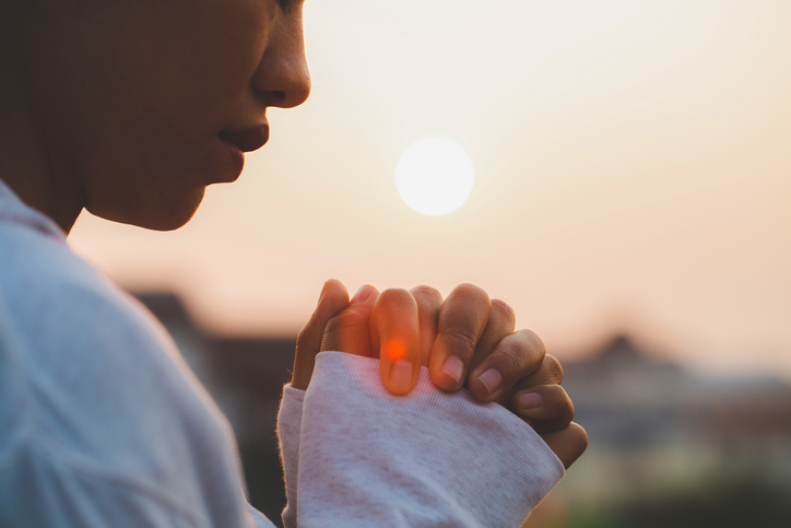 Woman praying in the morning