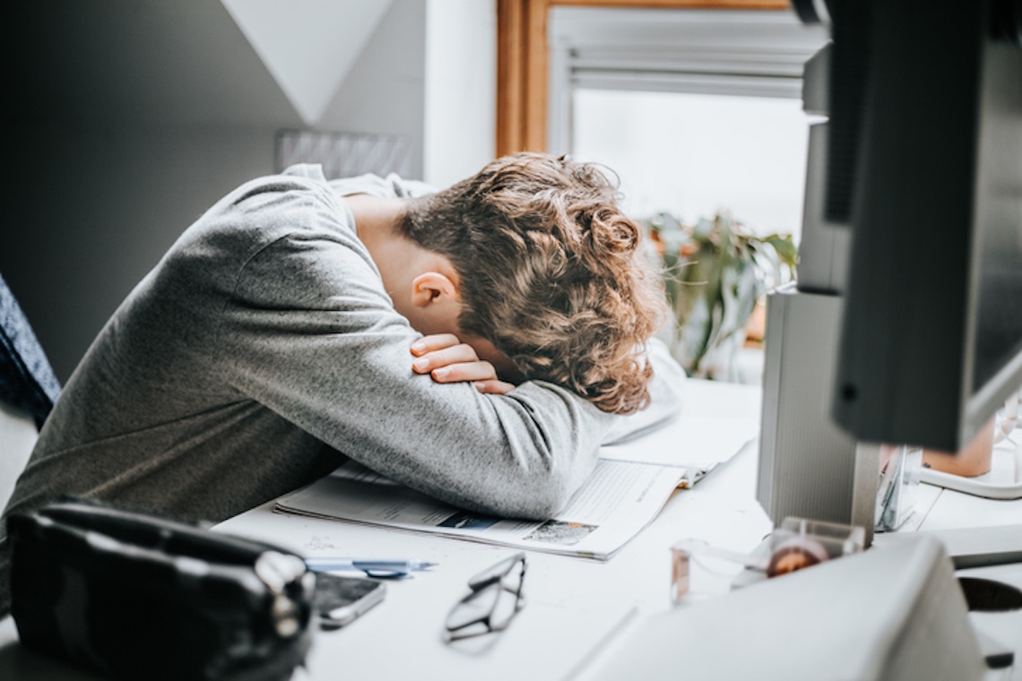 stressed person at desk.